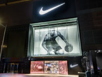 The storefront of a Nike store in China, featuring a giant image of a basketballer.