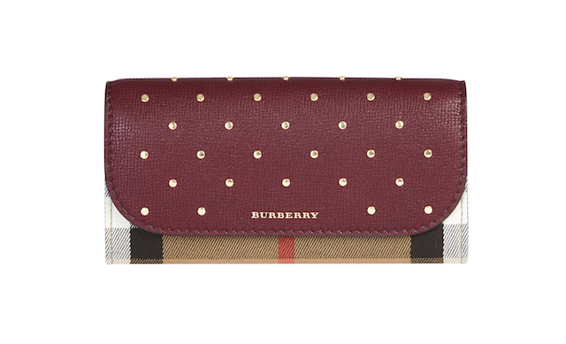 The Halton wallet in mahogany red and camel with gold studs