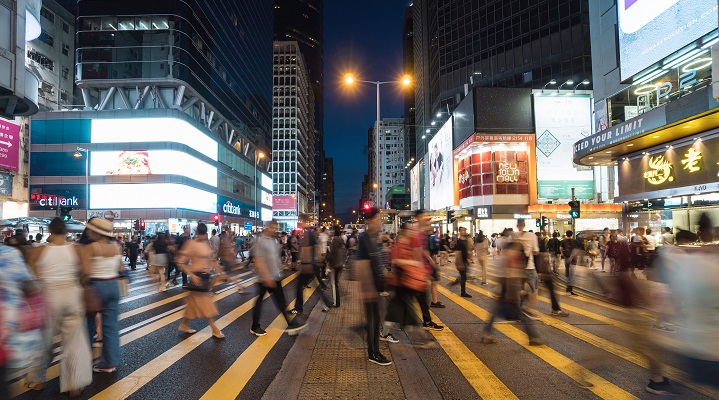 Image of people at night in Hong Kong