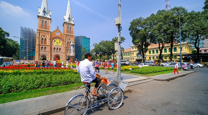 Image of man riding a bike in Saigon