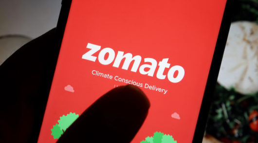 Zomato quarterly loss nearly halves as orders surge