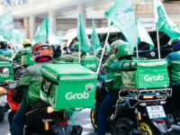Grab says its delivery business breaks even, losses narrow