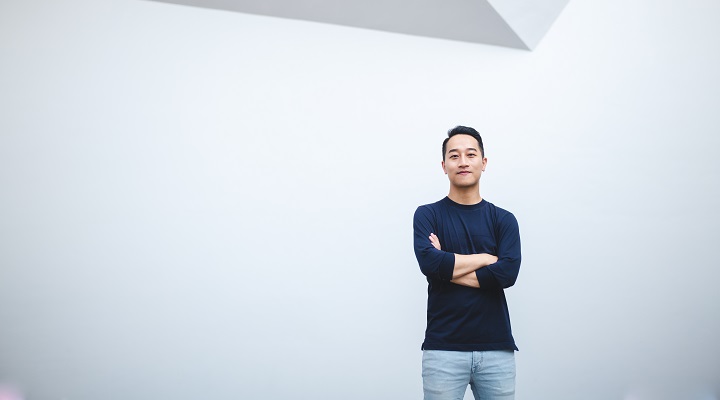 Preface founder Tommie Lo standing in front of a wall with his arms crossed.