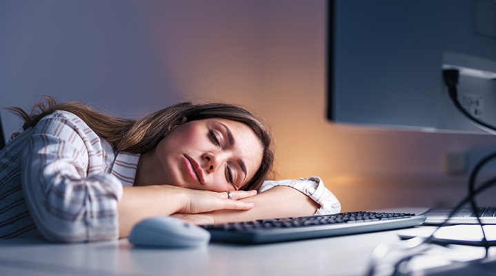 bigstock-Tired-Woman-Sleeping-At-Her-De-467560521.jpg