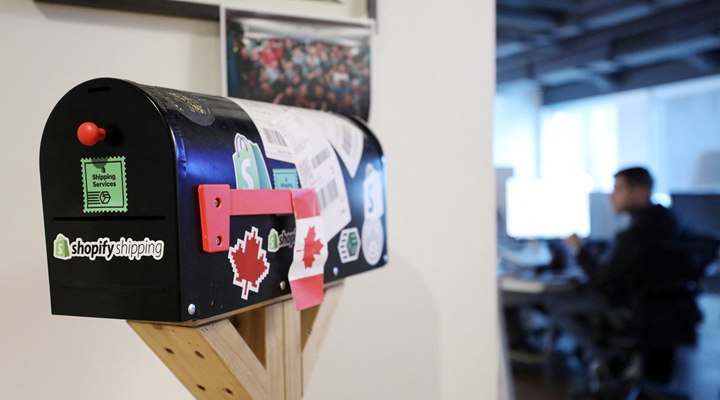 A mailbox with Shopify logo sticker on it