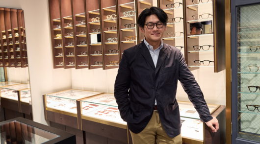 an image of kaneko ceo toru akita in a store