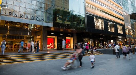 people walk on Orchard Road in Singapore
