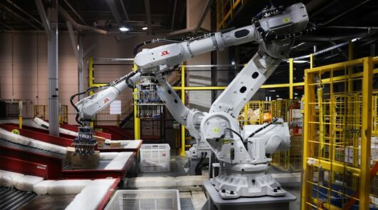 An industrial robot arm works at JD.com sorting centre in China
