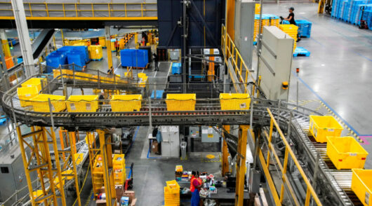 Workers organize products during Cyber Monday at the Amazon's fulfillment center in Robbinsville, New Jersey