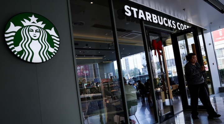 A customer walks out of a Starbucks coffee shop in Beijing
