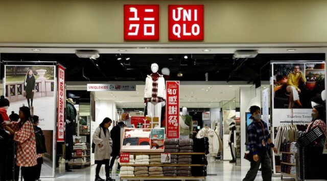 Shoppers look around for clothes at a Fast Retailing's Uniqlo store in Tokyo