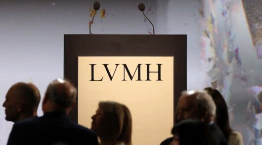 The logo of LVMH is seen on a desk before the annual shareholders meeting of LVMH Moet Hennessy Louis Vuitton in Paris