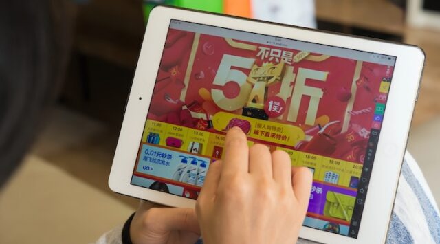 woman shopping through tablet on taobao on Chinese online shopping day on November 11